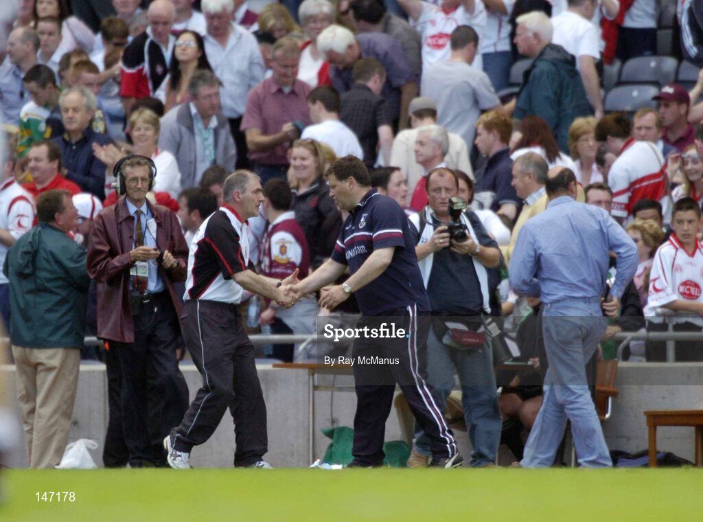 17 July 2004; Mickey Harte, Tyrone manager, is congratulated by his opposite number John O'Mahoney, Galway. Bank of Ireland Senior Football Championship Qualifier, Round 3, Tyrone v Galway, Croke Park, Dublin. Picture credit; Ray McManus / SPORTSFILE