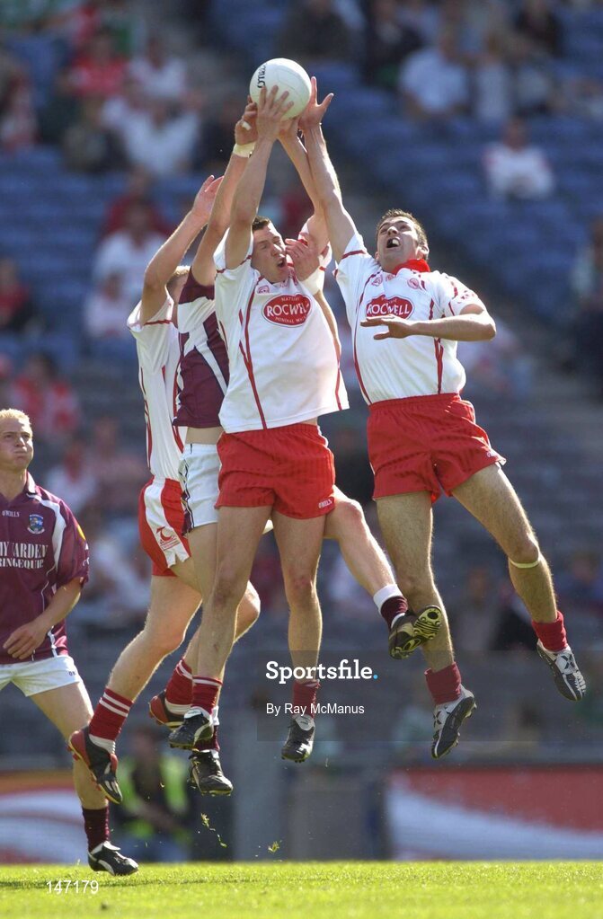 17 July 2004; Tyrone players Kevin Hughes, left, Sean Cavanagh and Joe McMahon, right, contest a high ball with  Sean O Domhnaill, Galway. Bank of Ireland Senior Football Championship Qualifier, Round 3, Tyrone v Galway, Croke Park, Dublin. Picture credit; Ray McManus / SPORTSFILE