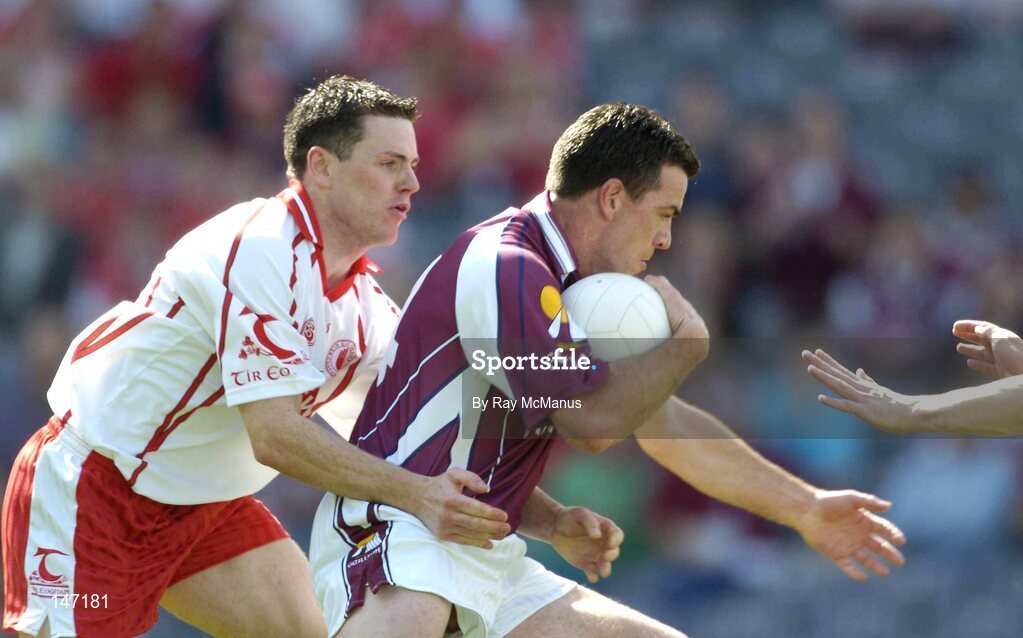 17 July 2004; Conor Gorman, Tyrone, takes down Galway's Padraic Joyce to concede a penalty. Bank of Ireland Senior Football Championship Qualifier, Round 3, Tyrone v Galway, Croke Park, Dublin. Picture credit; Ray McManus / SPORTSFILE