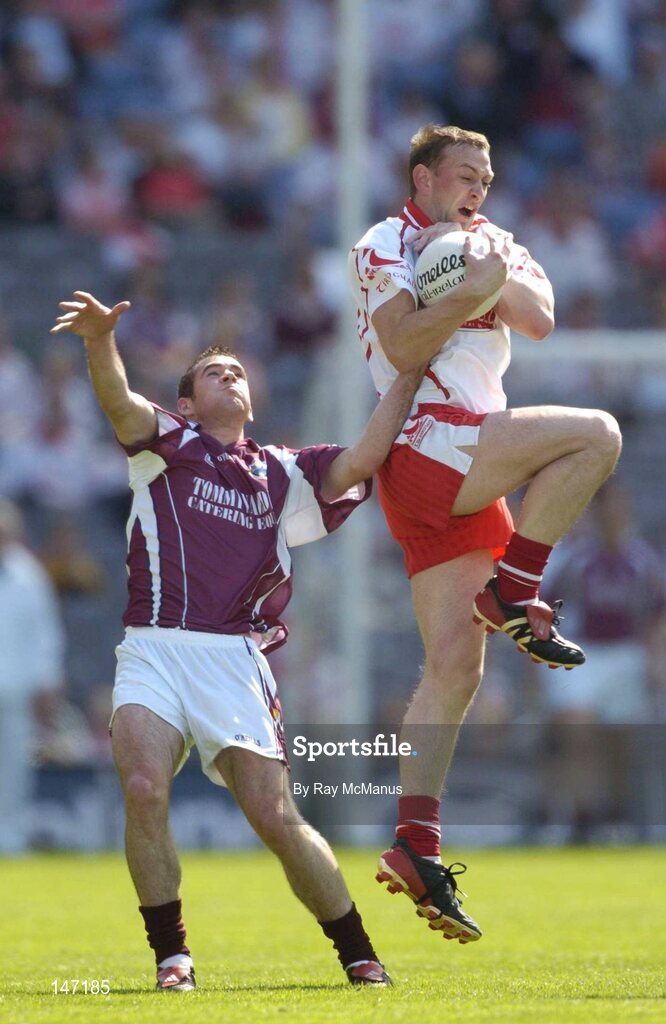 17 July 2004; Gerard Cavlan, Tyrone, in action against Damien Burke, Galway. Bank of Ireland Senior Football Championship Qualifier, Round 3, Tyrone v Galway, Croke Park, Dublin. Picture credit; Ray McManus / SPORTSFILE