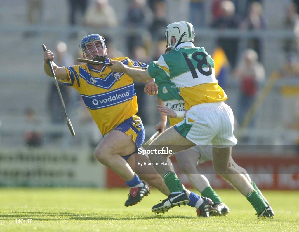 17 July 2004; Andrew Quinn, Clare, in action against Kevin Brady, Offaly. Guinness Senior Hurling Championship Qualifier, Round 3, Clare v Offaly, Gaelic Grounds, Limerick. Picture credit; Brendan Moran / SPORTSFILE
