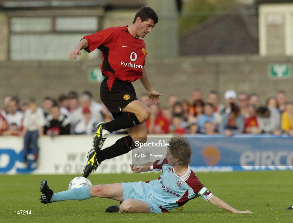 17 July 2004; Roy Keane, Manchester United XI, in action against Stephen Yelverton, Cobh Ramblers. Friendly game, Cobh Ramblers v Manchester United XI, Turners Cross, Cork. Picture credit; Matt Browne / SPORTSFILE