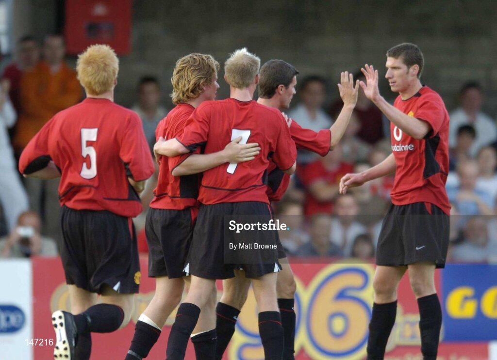 17 July 2004; Manchester United XI players celebrate the opening goal against Cobh Rambler, from left, Paul McShane, 5, goal scorer Mads Timm , Luke Chadwick, 7, Roy Keane and Kenny Cooper. Friendly game, Cobh Ramblers v Manchester United X1, Turners Cross, Cork. Picture credit; Matt Browne / SPORTSFILE