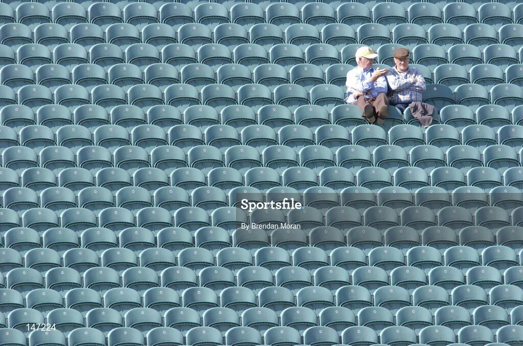 17 July 2004; Two supporters put their feet up while discussing the game. Guinness Senior Hurling Championship Qualifier, Round 3, Clare v Offaly, Gaelic Grounds, Limerick. Picture credit; Brendan Moran / SPORTSFILE