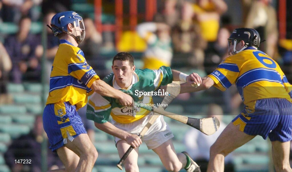 17 July 2004; Michael Cordial, Offaly, is tackled by Gerry O'Grady, left, and Sean McMahon, Clare. Guinness Senior Hurling Championship Qualifier, Round 3, Clare v Offaly, Gaelic Grounds, Limerick. Picture credit; Brendan Moran / SPORTSFILE