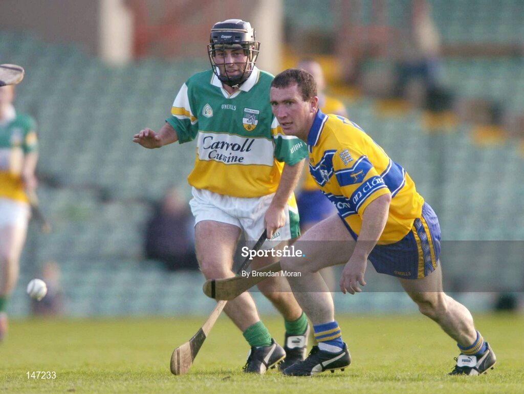 17 July 2004; Brian Quinn, Clare, in action against Damien Murphy, Offaly. Guinness Senior Hurling Championship Qualifier, Round 3, Clare v Offaly, Gaelic Grounds, Limerick. Picture credit; Brendan Moran / SPORTSFILE