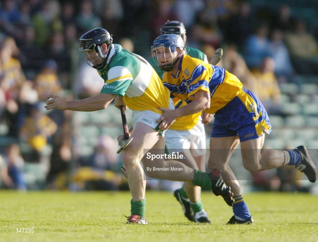 17 July 2004; Neville Coughlan, Offaly, is tackled by Gerry O'Grady, Clare. Guinness Senior Hurling Championship Qualifier, Round 3, Clare v Offaly, Gaelic Grounds, Limerick. Picture credit; Brendan Moran / SPORTSFILE