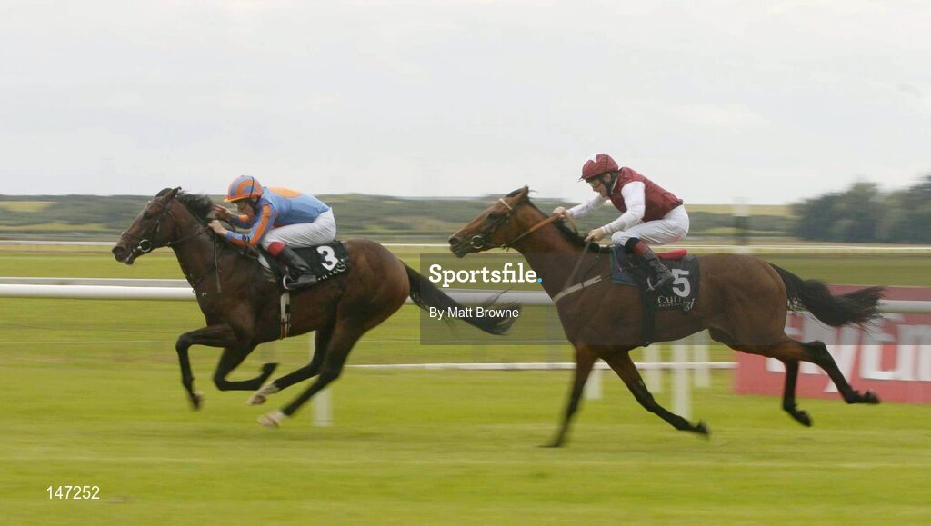 18 July 2004; Carnegie Hall, 3, with Jamie Spencer up, on their way to winning the Jumeirah International EBF (C&G) Maiden from second place Laudable, 5, with Mick Kinane. Curragh Racecourse, Co. Kildare. Picture credit; Matt Browne / SPORTSFILE