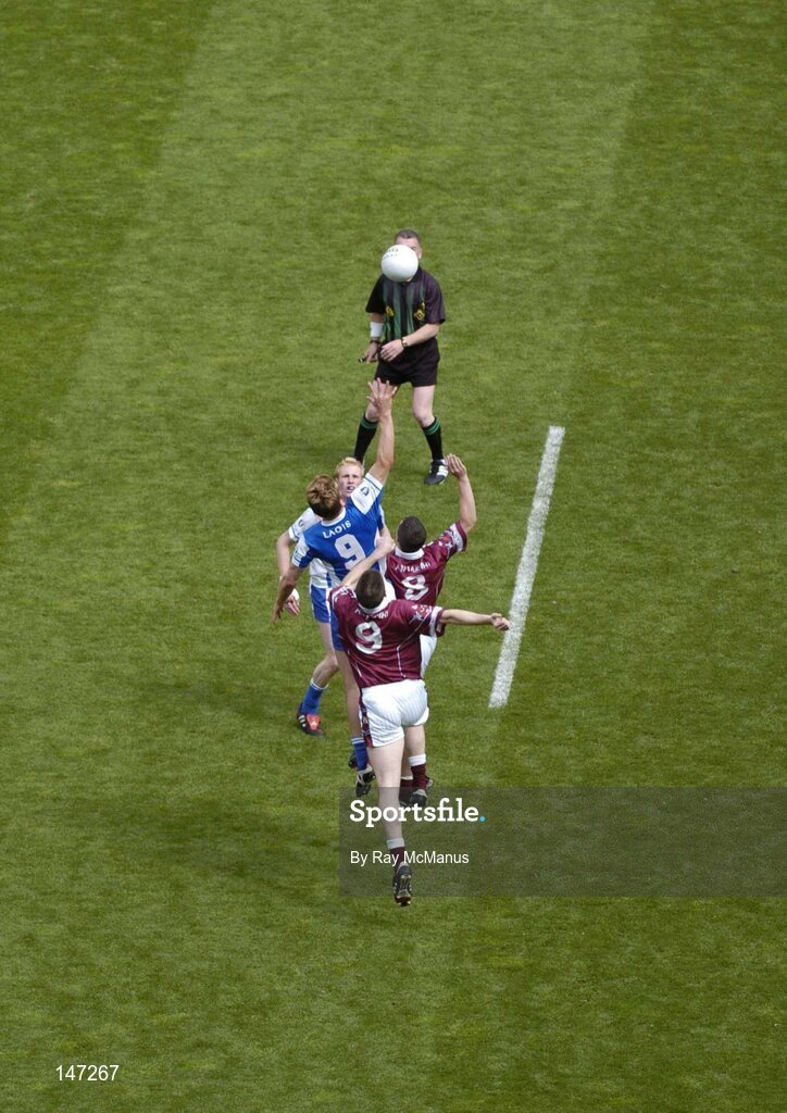 18 July 2004; Referee Pat McEnaney throws in the ball to start the game between Laois players Padraig Clancy and Noel Garvan and Westmeath players Gary  Dolan and David O'Shaughnessy. Bank of Ireland Leinster Senior Football Championship Final, Laois v Westmeath, Croke Park, Dublin. Picture credit; Ray McManus / SPORTSFILE