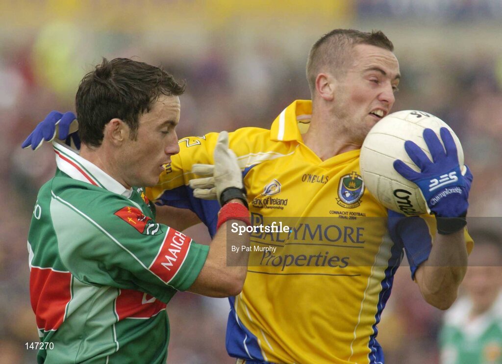 18 July 2004; Jonathon Dunning, Roscommon, in action against Conor Moran, Mayo. Bank of Ireland Connacht Senior Football Championship Final, Mayo v Roscommon, McHale Park, Castlebar, Co. Mayo. Picture credit; Pat Murphy / SPORTSFILE