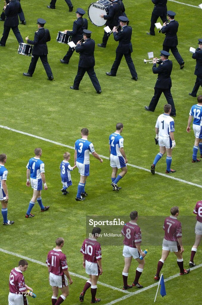 18 July 2004; The Laois and Westmeath teams follow the Garda band during the parade. Bank of Ireland Leinster Senior Football Championship Final, Laois v Westmeath, Croke Park, Dublin. Picture credit; Ray McManus / SPORTSFILE
