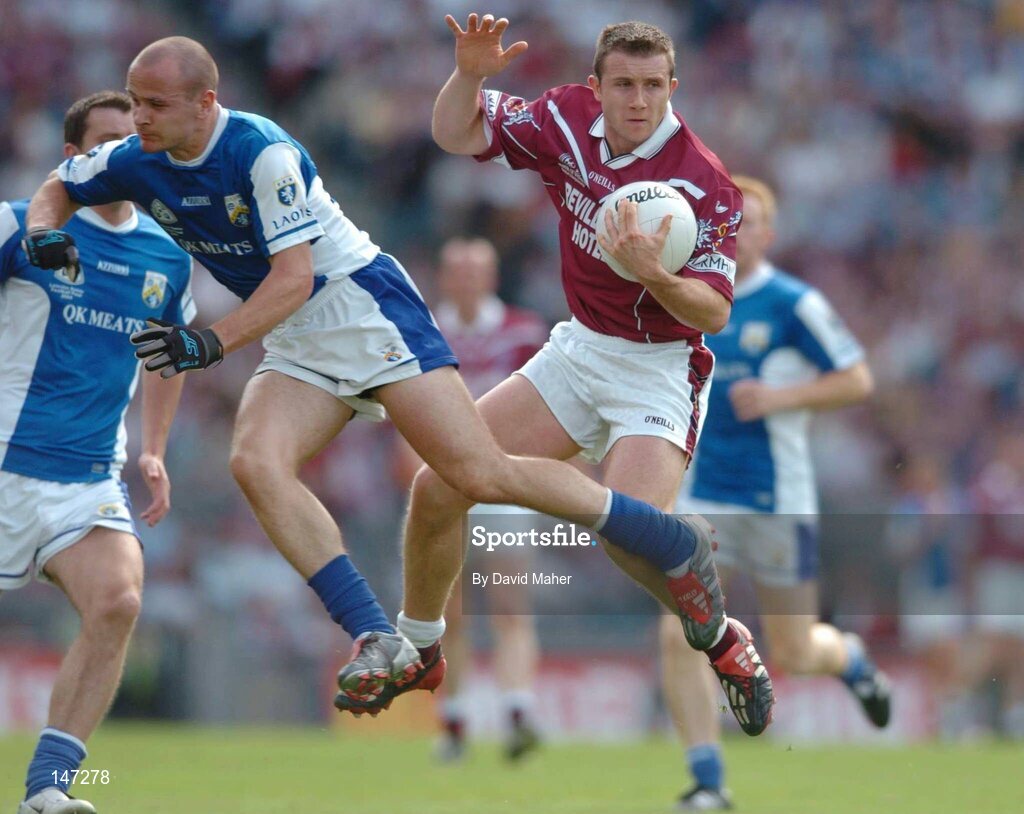 18 July 2004; Derek Heavin, Westmeath, in action against Tom Kelly, Laois. Bank of Ireland Leinster Senior Football Championship Final, Laois v Westmeath, Croke Park, Dublin. Picture credit; David Maher / SPORTSFILE