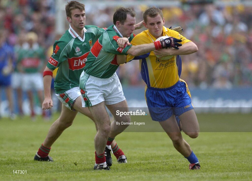 18 July 2004; Gary Cox, Roscommon, in action against Fergal Costello and Ronan McGarrity, left, Mayo. Bank of Ireland Connacht Senior Football Championship Final, Mayo v Roscommon, McHale Park, Castlebar, Co. Mayo. Picture credit; Damien Eagers / SPORTSFILE