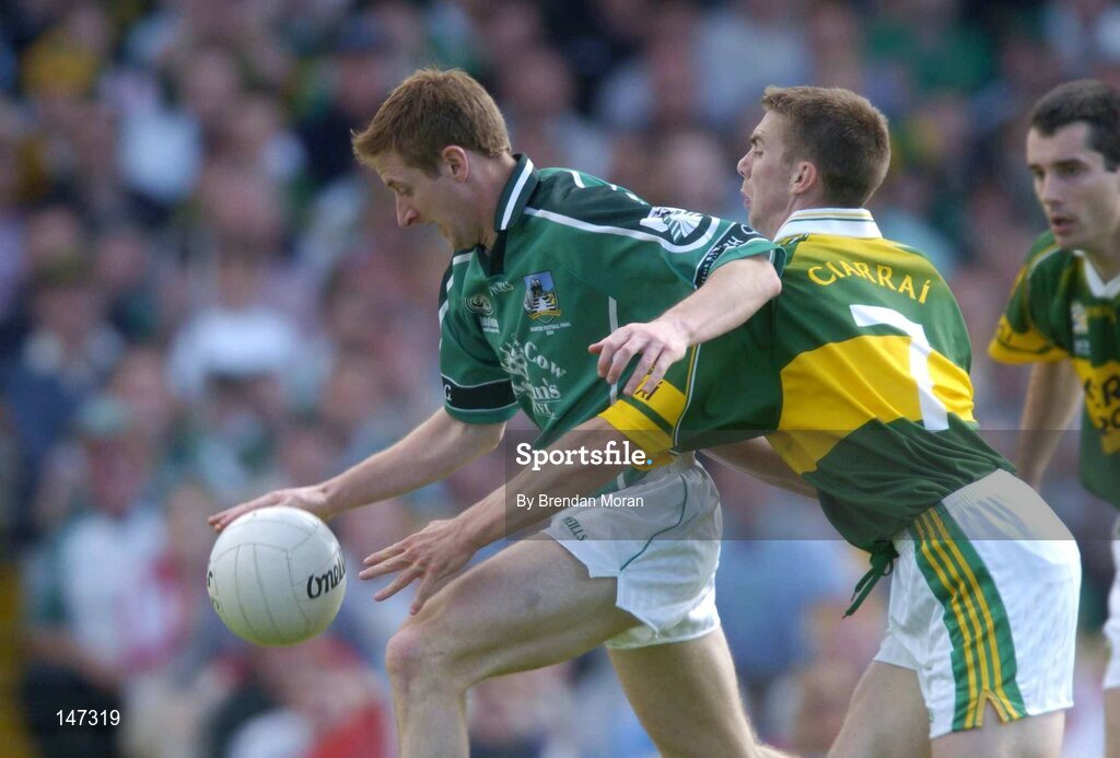 18 July 2004; Eoin Keating, Limerick, is tackled by Kerry's Marc O'Se, which led to Limerick's penalty. Bank of Ireland Munster Senior Football Championship Final Replay, Kerry v Limerick, Fitzgerald Stadium, Killarney, Co. Kerry. Picture credit; Brendan Moran / SPORTSFILE