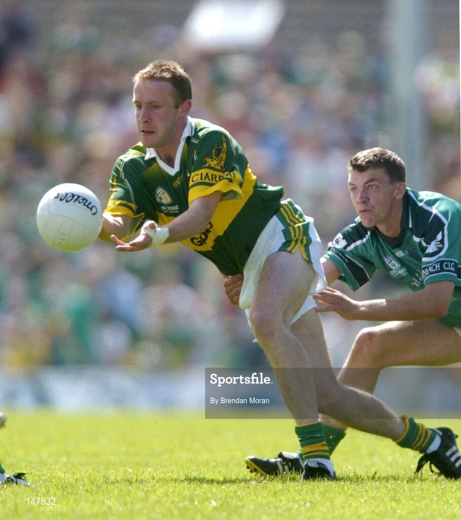 18 July 2004; Tommy Griffin, Kerry, in action against Mike O'Brien, Limerick. Bank of Ireland Munster Senior Football Championship Final Replay, Kerry v Limerick, Fitzgerald Stadium, Killarney, Co. Kerry. Picture credit; Brendan Moran / SPORTSFILE