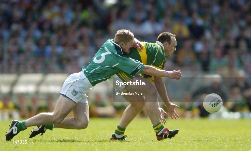 18 July 2004; John Crowley, Kerry, in action against Johnny McCarthy, Limerick. Bank of Ireland Munster Senior Football Championship Final Replay, Kerry v Limerick, Fitzgerald Stadium, Killarney, Co. Kerry. Picture credit; Brendan Moran / SPORTSFILE