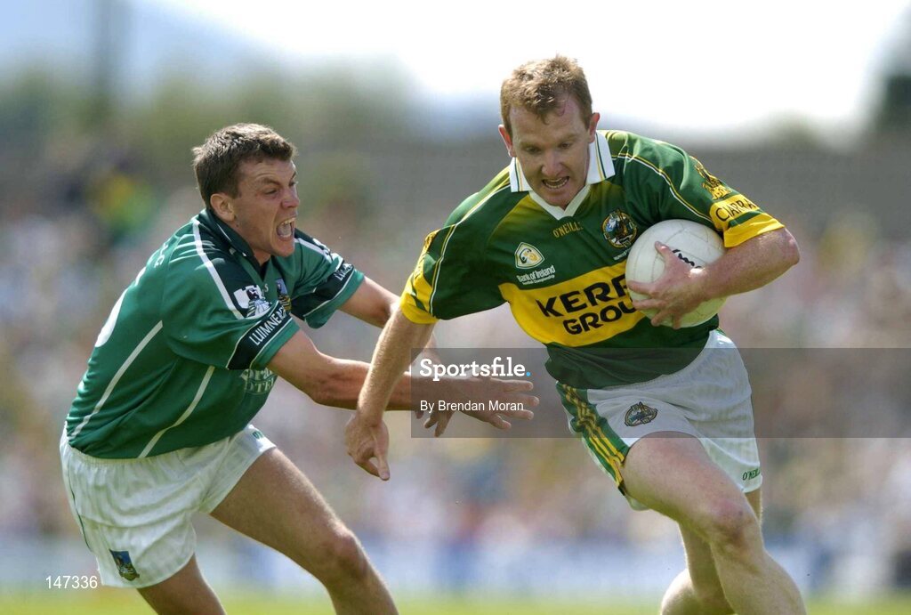 18 July 2004; Liam Hassett, Kerry, escapes the tackle of Mike O'Brien, Limerick. Bank of Ireland Munster Senior Football Championship Final Replay, Kerry v Limerick, Fitzgerald Stadium, Killarney, Co. Kerry. Picture credit; Brendan Moran / SPORTSFILE