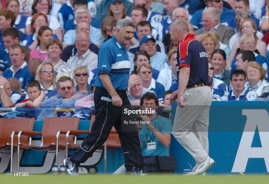 18 July 2004; Paidi O'Se, right, Westmeath manager, walks by Mick O'Dwyer, Laois manager, during the game. Bank of Ireland Leinster Senior Football Championship Final, Laois v Westmeath, Croke Park, Dublin. Picture credit; David Maher / SPORTSFILE