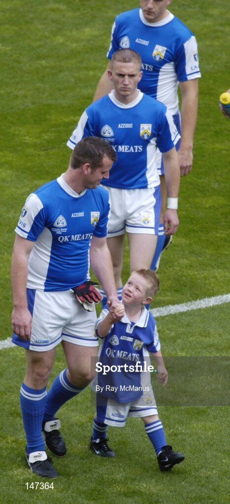 18 July 2004; The Laois full-back Colm Byrne and his son Cian during the parade. Bank of Ireland Leinster Senior Football Championship Final, Laois v Westmeath, Croke Park, Dublin. Picture credit; Ray McManus / SPORTSFILE