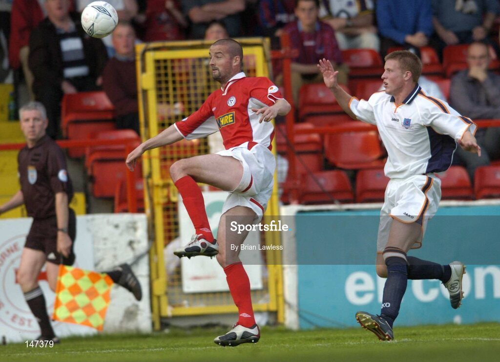 18 July 2004; Dave Rogers, Shelbourne, in action against Mark Rooney, Drogheda United. eircom league, Premier Division, Shelbourne v Drogheda United, Tolka Park, Dublin. Picture credit; Brian Lawless / SPORTSFILE