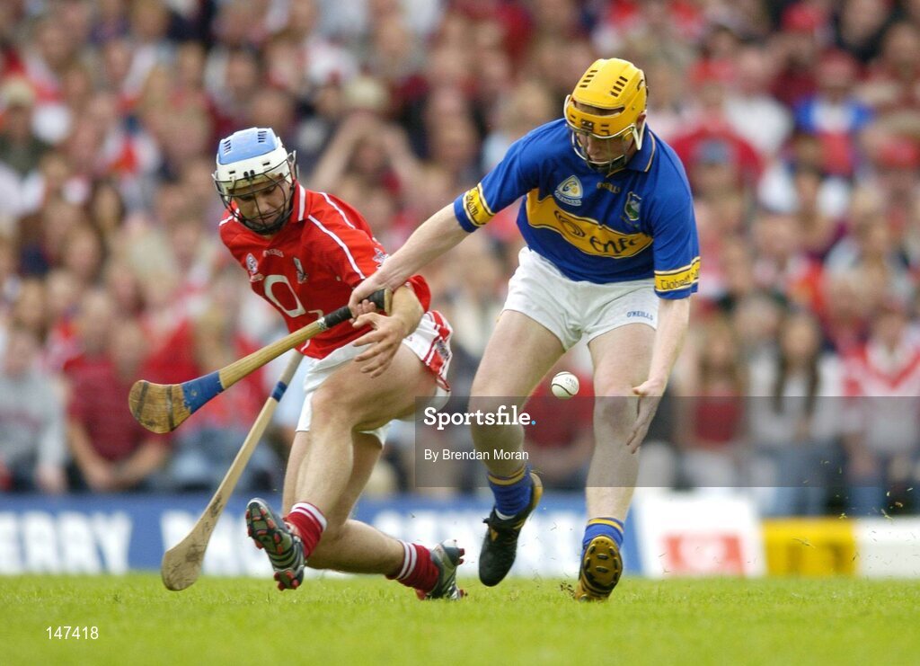 10 July 2004; Eamon Corcoran, Tipperary, in action against Garvan McCarthy, Cork. Guinness Senior Hurling Championship Qualifier, Round 3, Cork v Tipperary, Fitzgerald Stadium, Killarney, Co. Kerry. Picture credit; Brendan Moran / SPORTSFILE