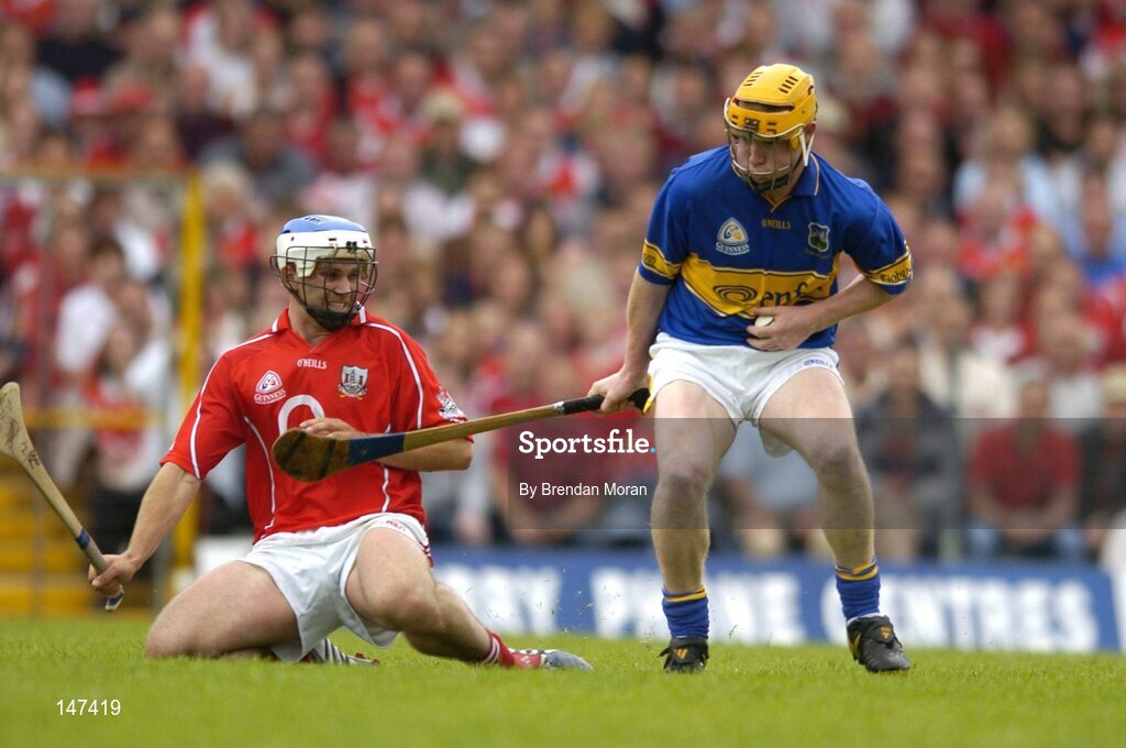 10 July 2004; Eamon Corcoran, Tipperary, in action against Garvan McCarthy, Cork. Guinness Senior Hurling Championship Qualifier, Round 3, Cork v Tipperary, Fitzgerald Stadium, Killarney, Co. Kerry. Picture credit; Brendan Moran / SPORTSFILE