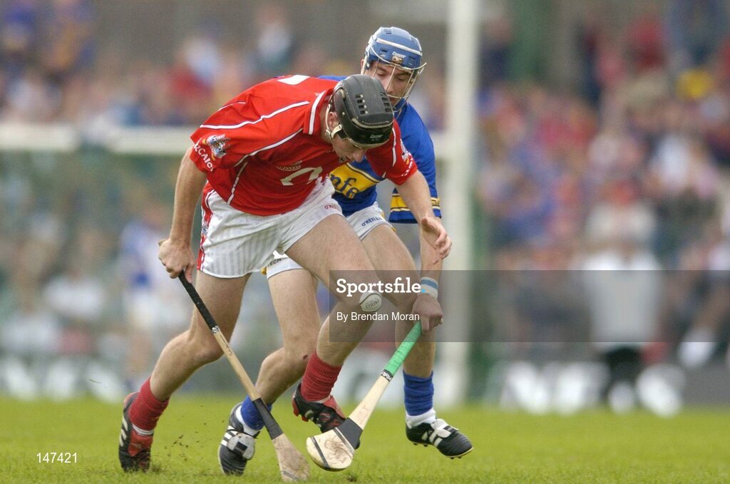 10 July 2004; John Gardiner, Cork, in action against Benny Dunne, Tipperary. Guinness Senior Hurling Championship Qualifier, Round 3, Cork v Tipperary, Fitzgerald Stadium, Killarney, Co. Kerry. Picture credit; Brendan Moran / SPORTSFILE