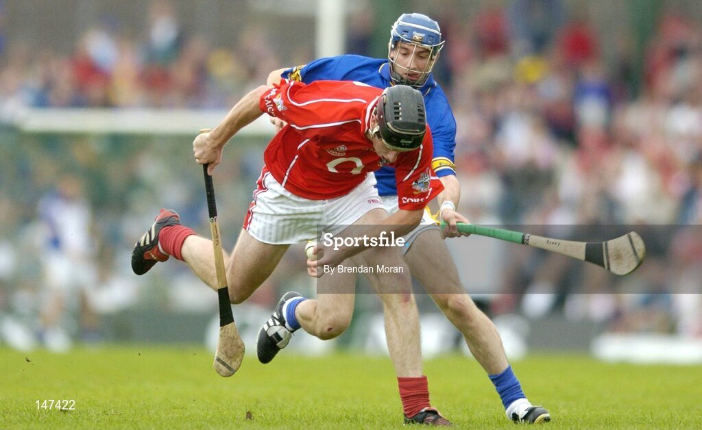 10 July 2004; John Gardiner, Cork, in action against Benny Dunne, Tipperary. Guinness Senior Hurling Championship Qualifier, Round 3, Cork v Tipperary, Fitzgerald Stadium, Killarney, Co. Kerry. Picture credit; Brendan Moran / SPORTSFILE