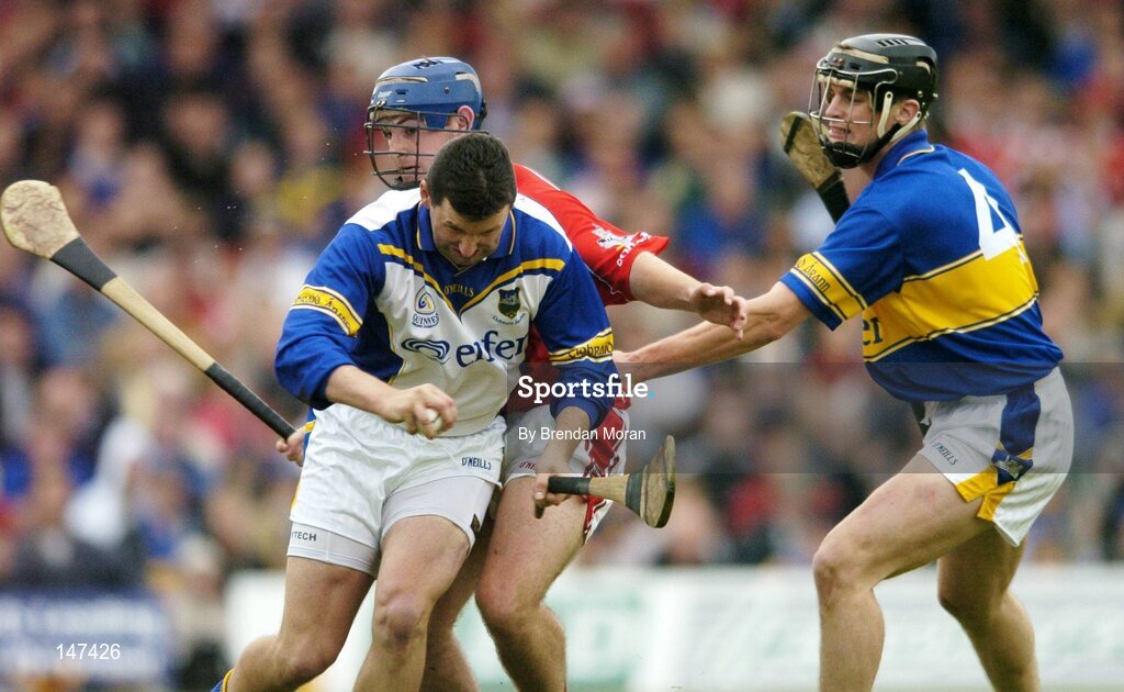 10 July 2004; Brendan Cummins, Tipperary, supported by team-mate Paul Curran (4), in action against Kieran Murphy, Cork. Guinness Senior Hurling Championship Qualifier, Round 3, Cork v Tipperary, Fitzgerald Stadium, Killarney, Co. Kerry. Picture credit; Brendan Moran / SPORTSFILE