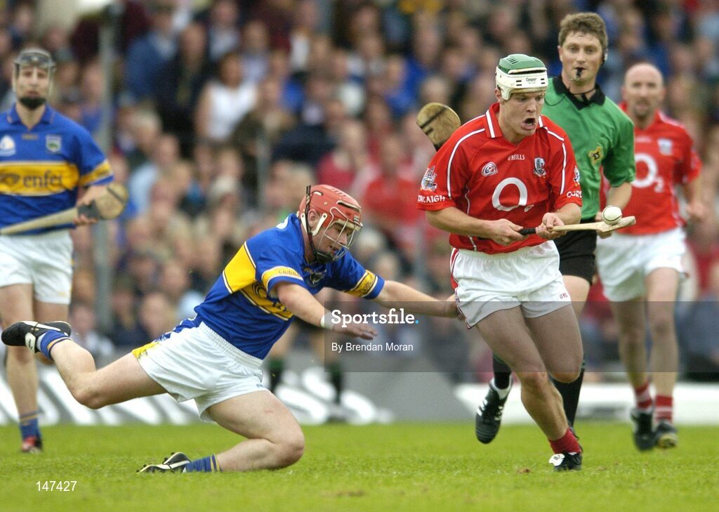 10 July 2004; Niall McCarthy, Cork, in action against Diarmuid Fitzgerald, Tipperary. Guinness Senior Hurling Championship Qualifier, Round 3, Cork v Tipperary, Fitzgerald Stadium, Killarney, Co. Kerry. Picture credit; Brendan Moran / SPORTSFILE