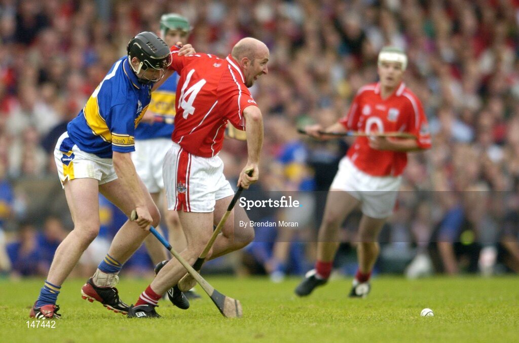10 July 2004; Brian Corcoran, Cork, in action against Philip Maher, Tipperary. Guinness Senior Hurling Championship Qualifier, Round 3, Cork v Tipperary, Fitzgerald Stadium, Killarney, Co. Kerry. Picture credit; Brendan Moran / SPORTSFILE