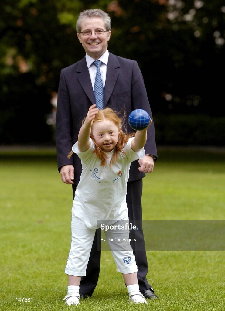 20 July 2004; Dr Phil Nolan, CEO of eircom, with Special Olympics Ireland athlete Helena Roche, aged 9, from Raheny, a member of Bayside Gym Club, who's demonstrating Bocce, one of two new sports to Special Olympics Ireland, at a photocall to celebrate eircom's 19 year support of the programme and announce details of eircom's continuing premier sponsorship of Special Olympics Ireland. Dublin. Picture credit; Damien Eagers / SPORTSFILE
