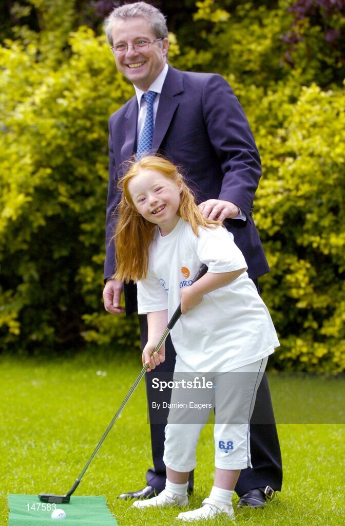 20 July 2004; Dr Phil Nolan, CEO of eircom, with Special Olympics Ireland athlete Helena Roche, aged 9, from Raheny, a member of Bayside Gym Club, demonstrating pitch and putt, one of the two new sports to Special Olympics Ireland, at a photocall to celebrate eircom's 19 year support of the programme and announce details of eircom's continuing premier sponsorship of Special Olympics Ireland. Dublin. Picture credit; Damien Eagers / SPORTSFILE