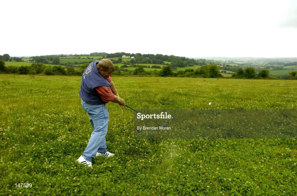 20 July 2004; John Daly, double Major winner and one of golf's most colourful players, makes a drive from what will be the first tee box while he was in Blarney, Co. Cork, to finalise plans for the new Blarney Golf Resort Championship course which he designed in conjunction with Mel Flanagan of Irish Golf Design. Picture credit; Brendan Moran / SPORTSFILE