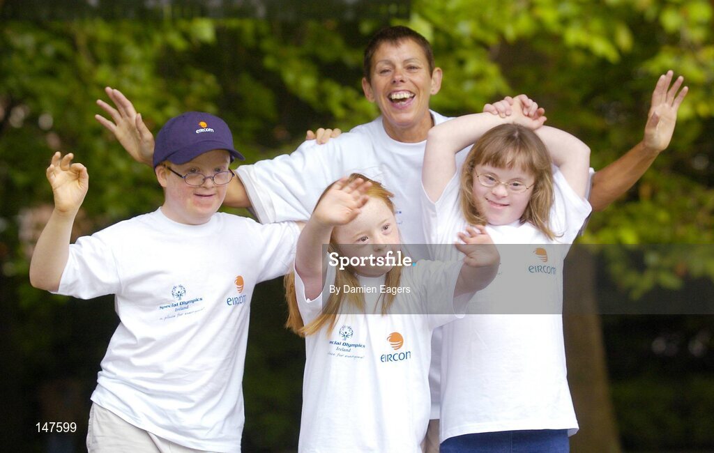20 July 2004; Rita Lawlor, Special Olympics coach, with Special Olympics Ireland athletes, from left, Philip Walsh, aged 11, from Malahide, Holly Matthews, aged 11, from Glasnevin, and Helena Roche, aged 9, from Raheny, all from Bayside Gym Club, at a photocall to celebrate eircom's 19 year support of the programme and announce details of eircom's continuing premier sponsorship of Special Olympics Ireland. Dublin. Picture credit; Damien Eagers / SPORTSFILE
