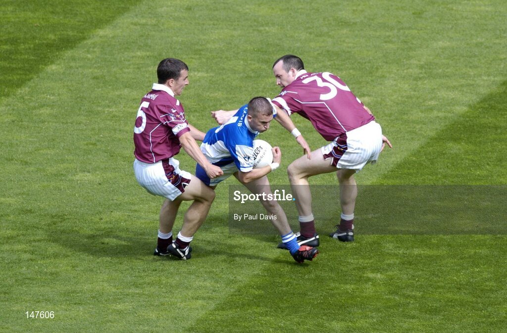 18 July 2004; Joe Higgins, Laois, in action against Michael Ennis, left, and Rory O'Connell, Westmeath. Bank of Ireland Leinster Senior Football Championship Final, Laois v Westmeath, Croke Park, Dublin. Picture credit; Ray McManus / SPORTSFILE
