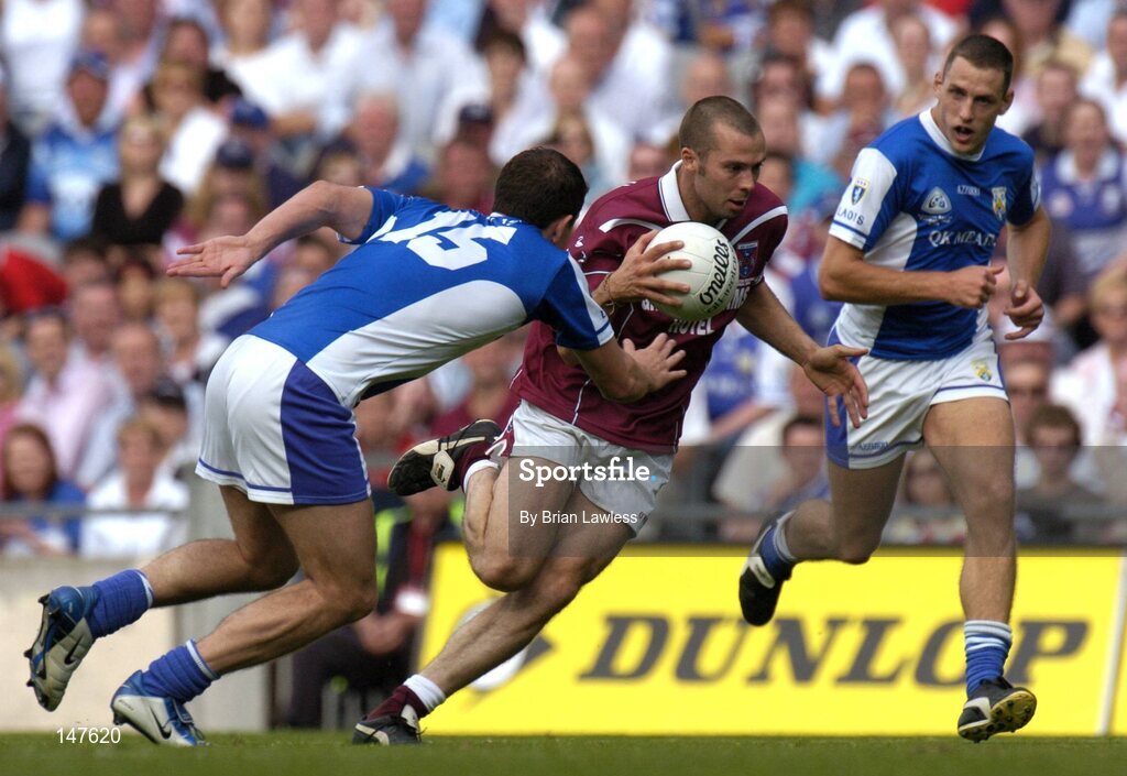 18 July 2004; Paul Conway, Westmeath, in action against Kevin Fitzpatrick, left, and Darren Rooney, Laois. Bank of Ireland Leinster Senior Football Championship Final, Laois v Westmeath, Croke Park, Dublin. Picture credit; Brian Lawless / SPORTSFILE