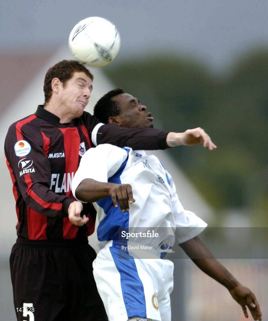 20 July 2004; Barry Ferguson, Longford Town, in action against Eloka Asokuh, Finn Harps. eircom League Cup Semi-Final, Finn Harps v Longford Town, Finn Park, Ballybofey, Co. Donegal. Picture credit; David Maher / SPORTSFILE