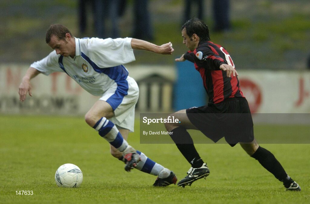 20 July 2004; Jonathan Minnock, Finn Harps, in action against John Martin, Longford Town. eircom League Cup Semi-Final, Finn Harps v Longford Town, Finn Park, Ballybofey, Co. Donegal. Picture credit; David Maher / SPORTSFILE