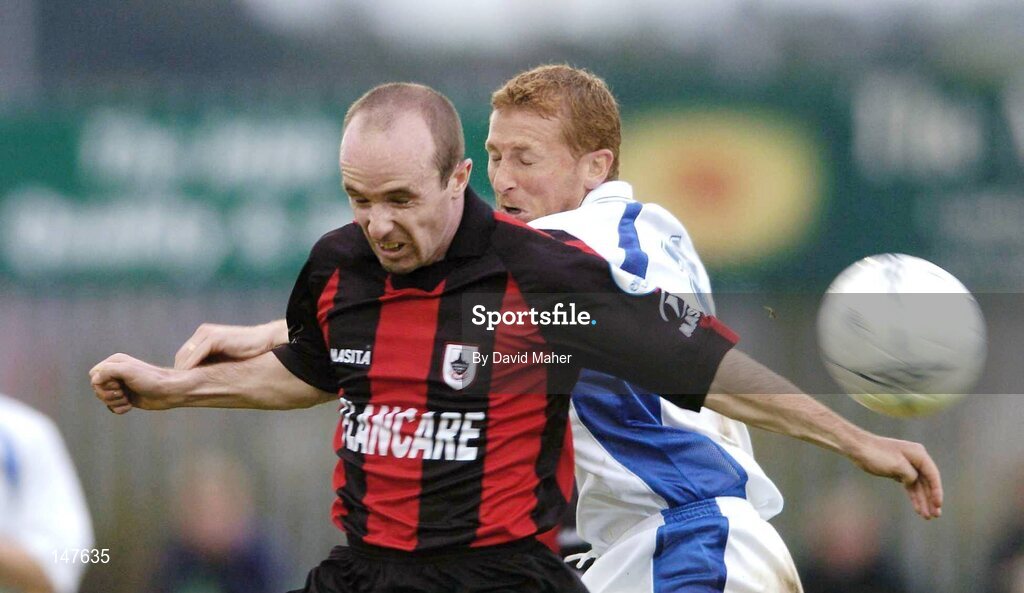 20 July 2004; Alan Kirby, Longford Town, in action against Tom Mohan, Finn Harps. eircom League Cup Semi-Final, Finn Harps v Longford Town, Finn Park, Ballybofey, Co. Donegal. Picture credit; David Maher / SPORTSFILE