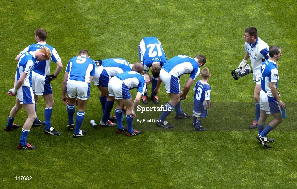 18 July 2004; Laois players adjust their socks before the pre-match parade. Bank of Ireland Leinster Senior Football Championship Final, Laois v Westmeath, Croke Park, Dublin. Picture credit; Ray McManus / SPORTSFILE