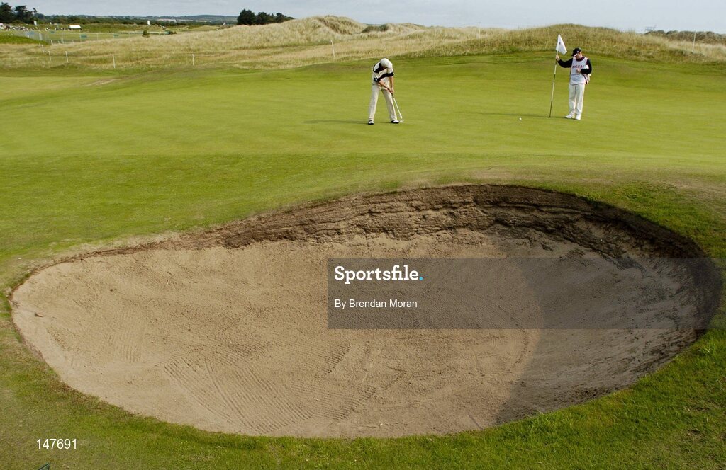 21 July 2004; Padraig Harrington putts on the 4th green. Nissan Irish Open Pro Am, County Louth Golf Club, Baltray, Co. Louth. Picture credit; Brendan Moran / SPORTSFILE