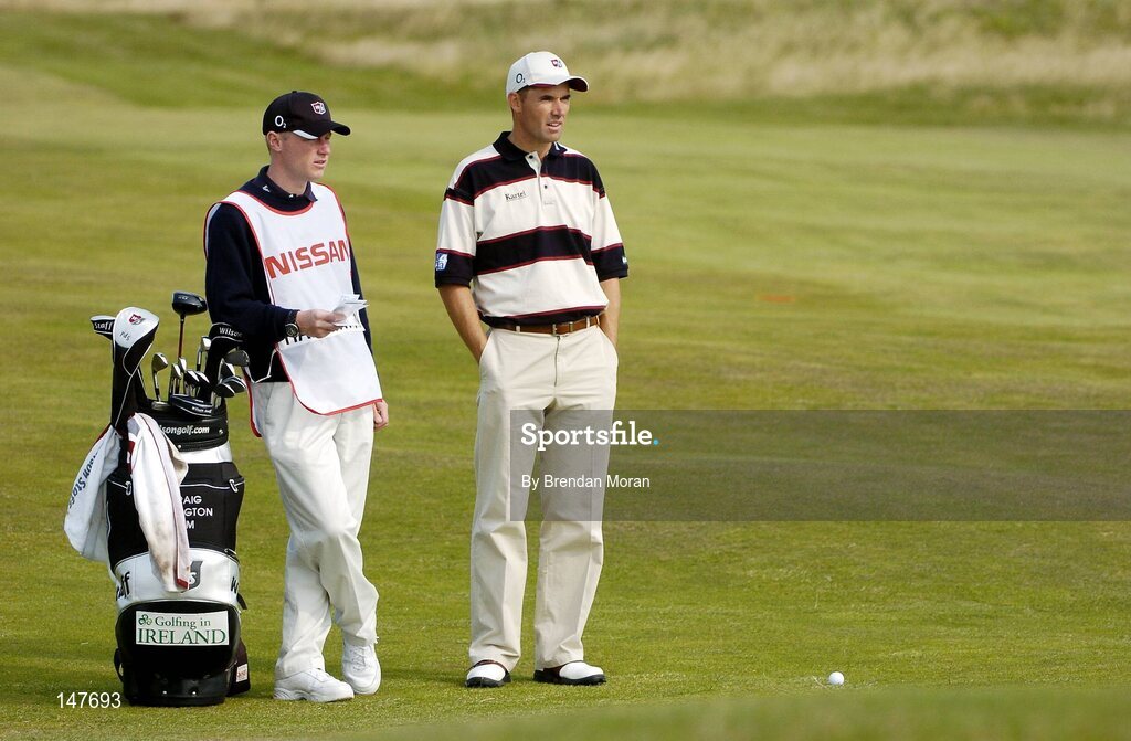 21 July 2004; Padraig Harrington waits to take his second shot on the 2nd fairway alongside caddie Ronan Flood. Nissan Irish Open Pro Am, County Louth Golf Club, Baltray, Co. Louth. Picture credit; Brendan Moran / SPORTSFILE