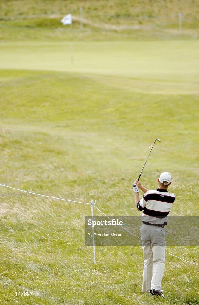 21 July 2004; Padraig Harrington watches his approach shot to the 4th green. Nissan Irish Open Pro Am, County Louth Golf Club, Baltray, Co. Louth. Picture credit; Brendan Moran / SPORTSFILE