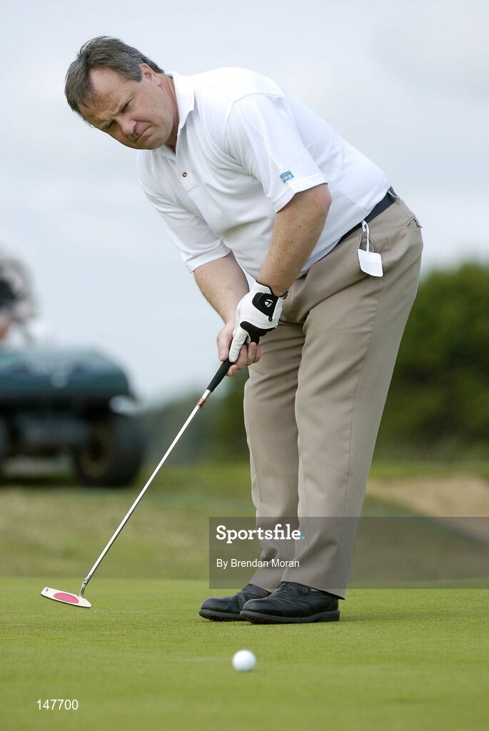 21 July 2004; Dublin football manager Tommy Lyons putts on the 7th green. Nissan Irish Open Pro Am, County Louth Golf Club, Baltray, Co. Louth. Picture credit; Brendan Moran / SPORTSFILE