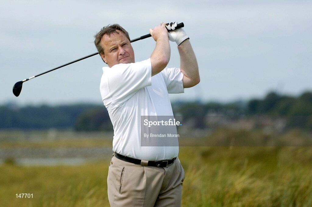 21 July 2004; Dublin football manager Tommy Lyons watches is drive from the 8th tee box. Nissan Irish Open Pro Am, County Louth Golf Club, Baltray, Co. Louth. Picture credit; Brendan Moran / SPORTSFILE