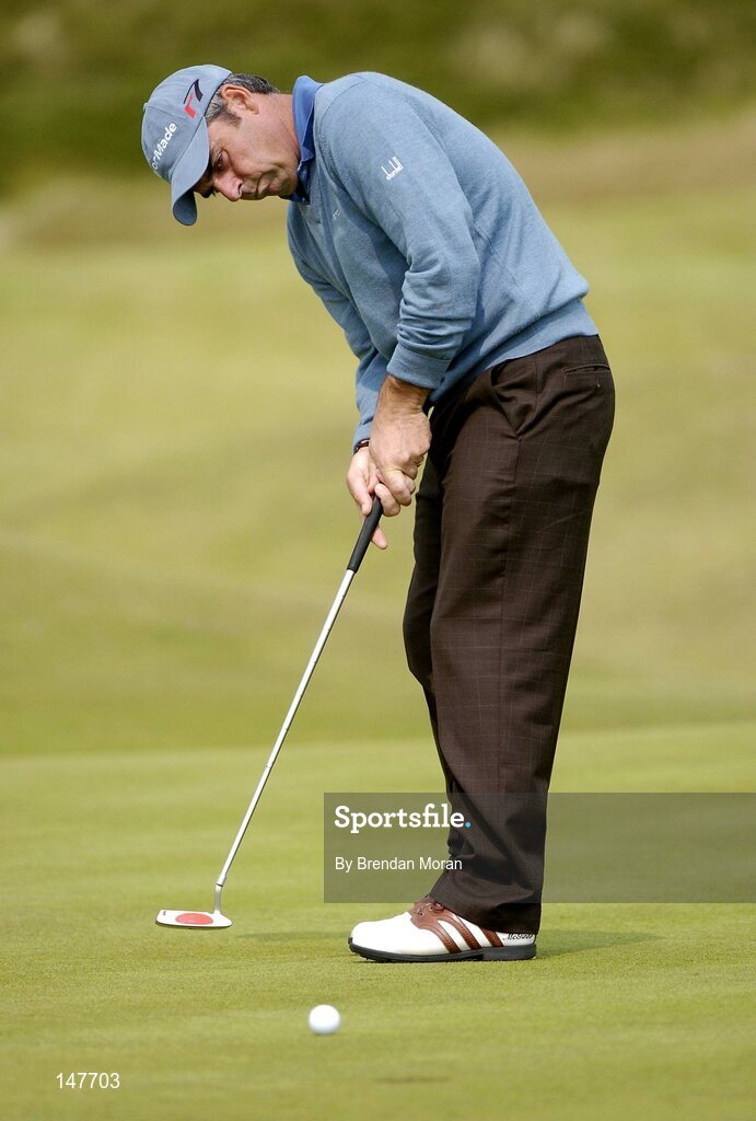 21 July 2004; Paul McGinley putts on the 4th green. Nissan Irish Open Pro Am, County Louth Golf Club, Baltray, Co. Louth. Picture credit; Brendan Moran / SPORTSFILE