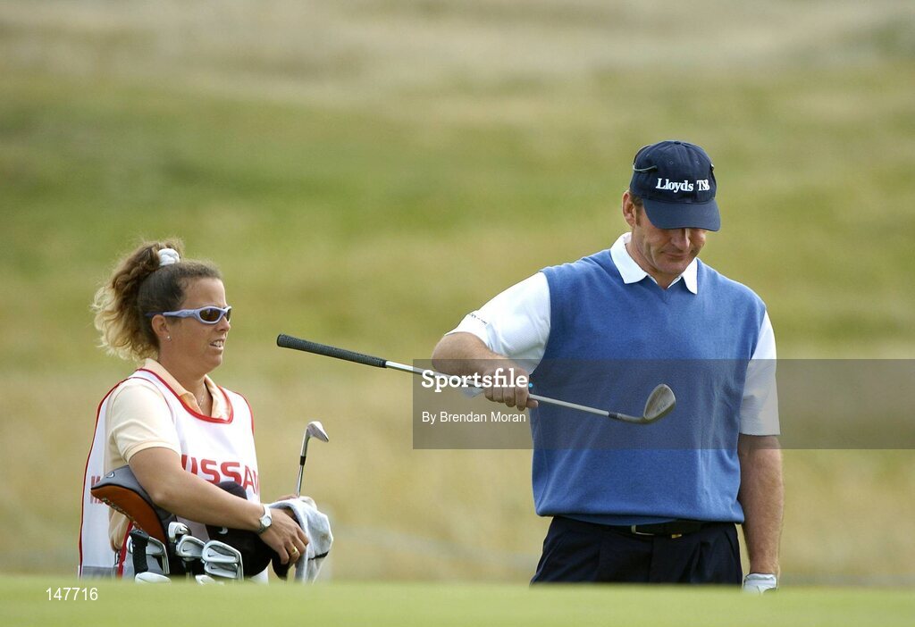 21 July 2004; Nick Faldo takes a club from caddie Fanny Sunesson during his round in the Pro Am before pulling out of the tournament. Nissan Irish Open Pro Am, County Louth Golf Club, Baltray, Co. Louth. Picture credit; Brendan Moran / SPORTSFILE