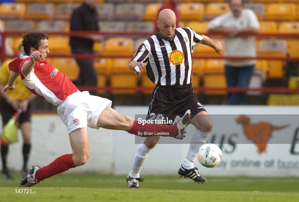 21 July 2004; Ollie Cahill, Shelbourne, in action against Arnar Gunnlaugsson, KR Reykjavik. UEFA Champions League 1st Qualifying Round, Second Leg, Shelbourne v KR Reykjavik, Tolka Park, Dublin. Picture credit; Brian Lawless / SPORTSFILE