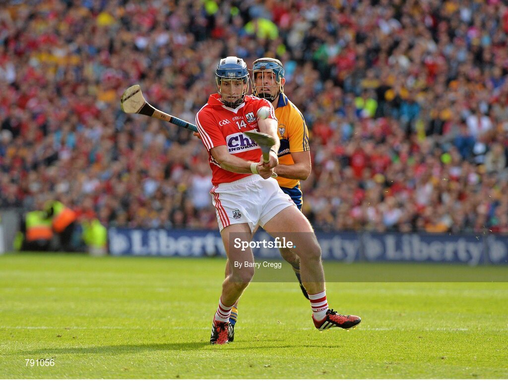 8 September 2013; Patrick Horgan, Cork, shoots to score a point in the final moments of the game despite the attention of Brendan Bugler, Clare. GAA Hurling All-Ireland Senior Championship Final, Cork v Clare, Croke Park, Dublin. Picture credit: Barry Cregg / SPORTSFILE